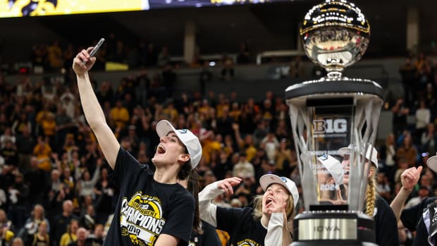 Iowa guard Caitlin Clark (22) celebrates the win after the game against Nebraska at Target Center in Minneapolis on March 10, 2024.